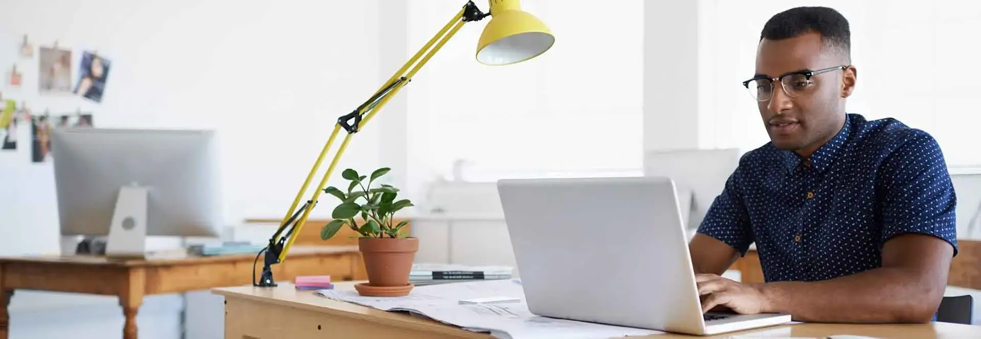 Professional reviewing online legal forms on a laptop in a US workspace